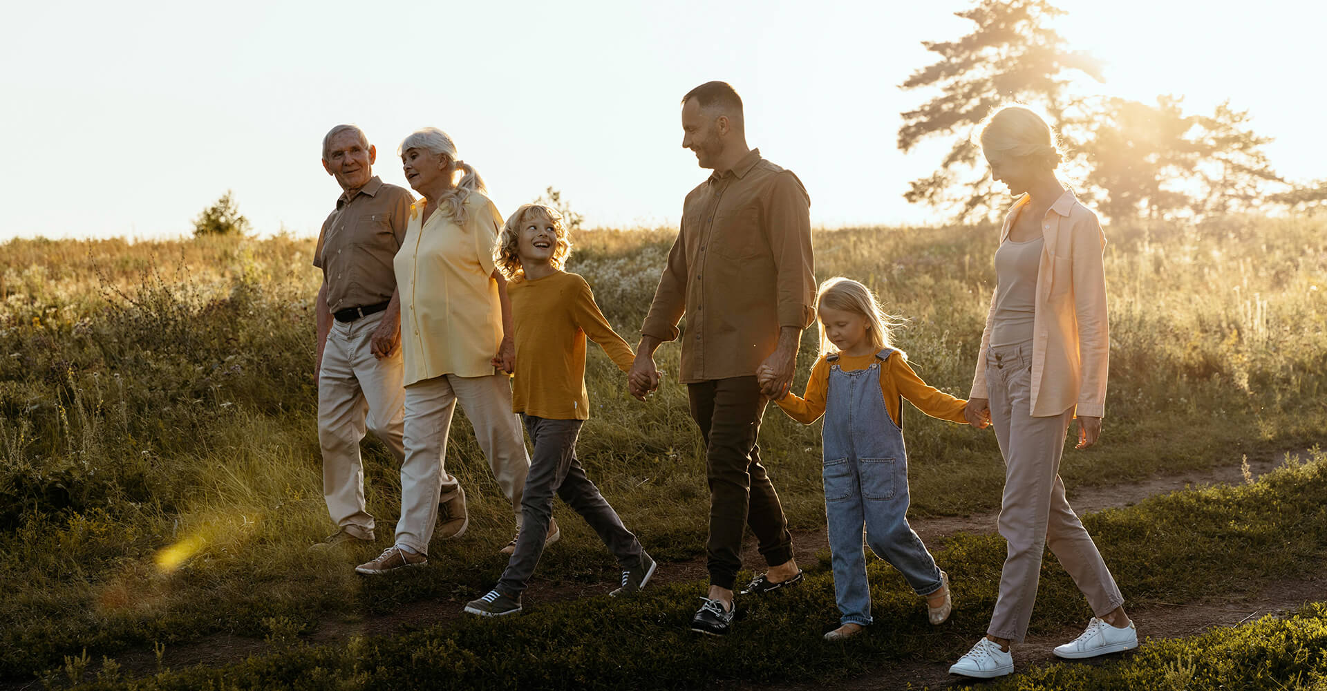 Multi-generational family walking together outdoors